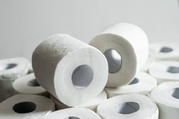 Toilet paper roll background. Concept of lack of toilet paper in stores due to Covid-19, coronavirus, hygiene, panic - Fotó, kép