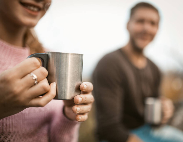 Females Hands Holding Steel Cup Outdoors - Photo, image