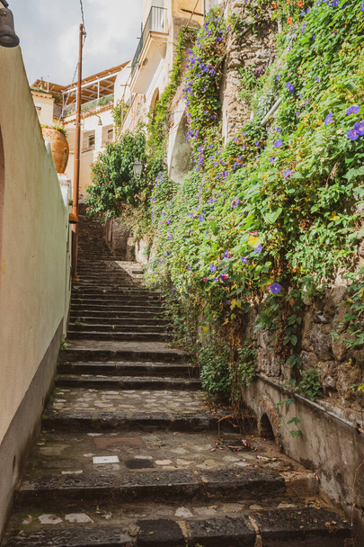 Narrow stairs and streets in the tourist village of Positano, Amalfi coast, travel to Italy - Photo, Image
