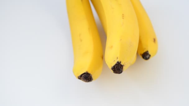 Bananas on a white background. Shooting of bananas. - Metraje, vídeo
