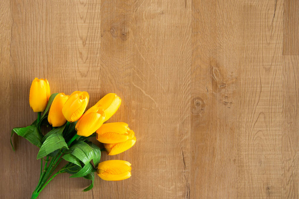 Tulips bunch on wooden background. Space for text. - Fotografie, Obrázek