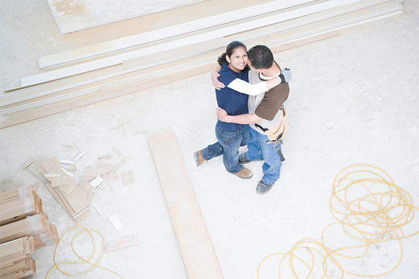 Couple hugging in their new home - Foto, imagen