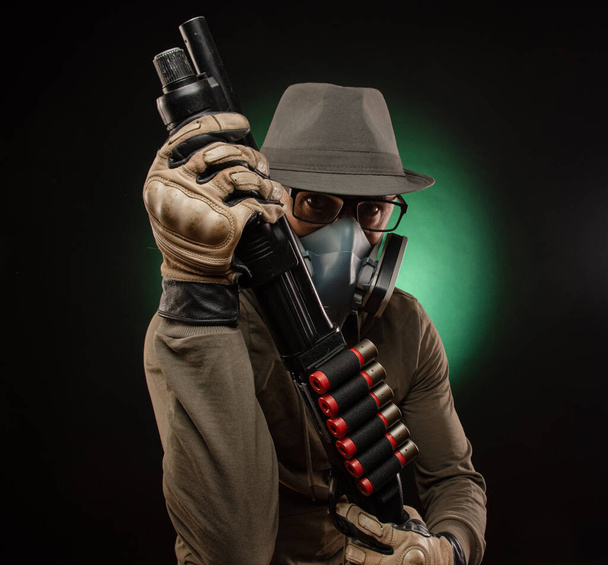 photo of man in gas mask on grey background - Фото, зображення