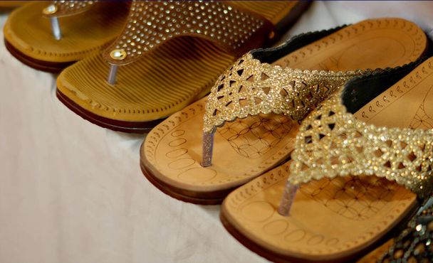 Closeup of Indian woman foot wear in display of a retail shop - Photo, Image