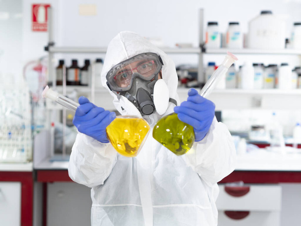 Scientist man investigating in a laboratory - Photo, Image
