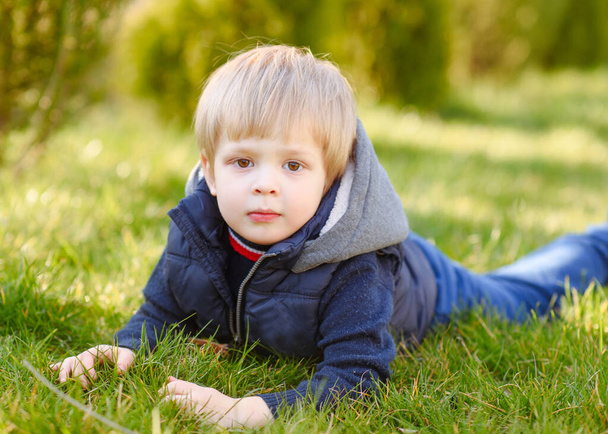 portrait of little model boy in nature - Foto, Imagem