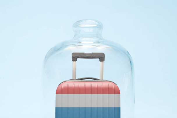 Suitcase with Luxembourgian flag design in quarantine minimal creative coronavirus travel restriction concept. - Photo, image