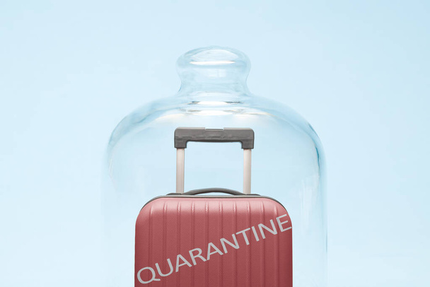 Suitcase in quarantine minimal creative coronavirus no travel concept. - Foto, imagen