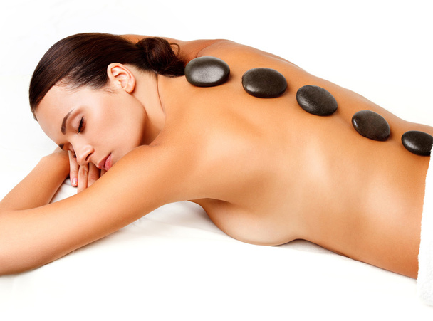 Stone Massage. Beautiful Woman Getting Spa Hot Stones Massage - Fotografie, Obrázek