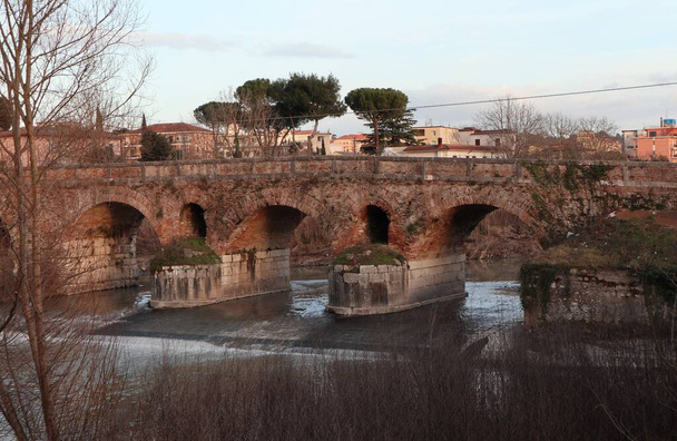 Benevento, Campania, Italy - February 13, 2020: Ancient Roman bridge over the Saturday river along the Via Appia - Photo, Image