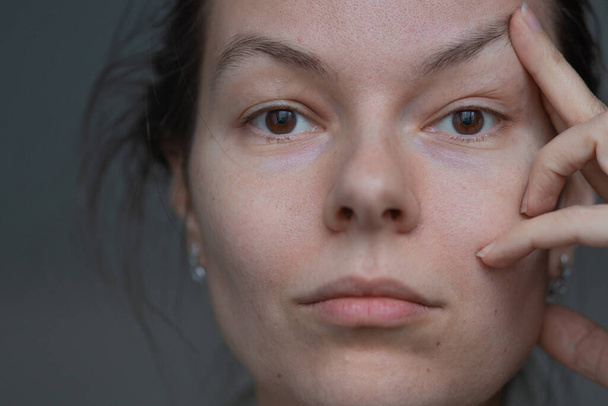 Skin care, portrait of a young beautiful woman close-up, without makeup and retouching. - Fotografie, Obrázek