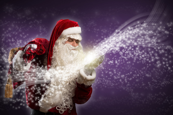 Papai Noel sopra faíscas mágicas
 - Foto, Imagem
