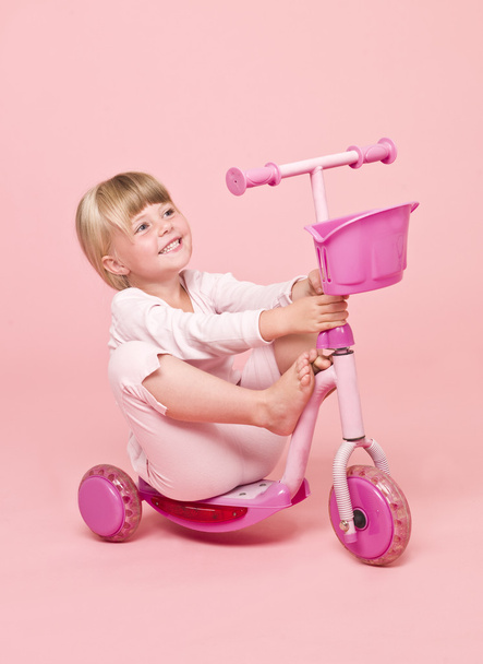 Girl sitting on a scooter - Valokuva, kuva
