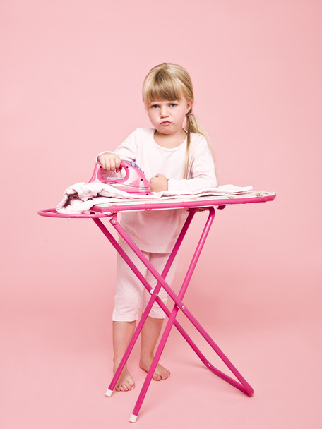 Angry girl ironing - Foto, afbeelding