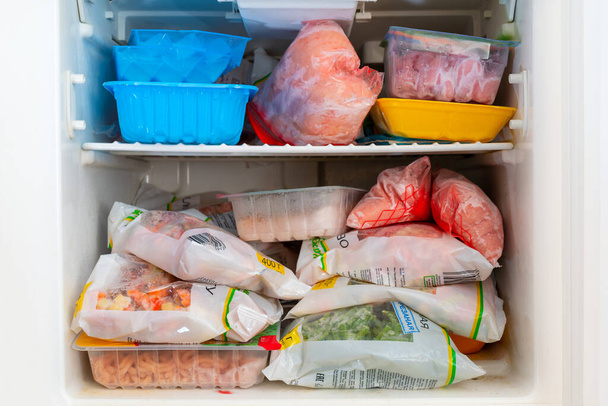 Frozen vegetables in fridge close up shot. - Photo, Image