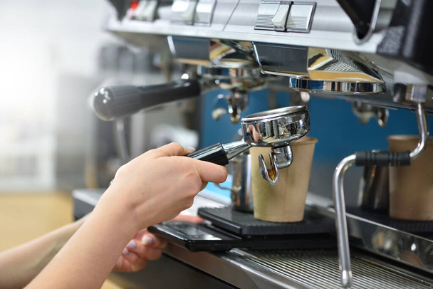 Barista bartender and hands while making coffee on a coffee machine - Φωτογραφία, εικόνα