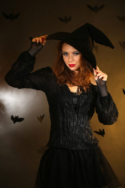 Halloween witch on dark background - Fotó, kép
