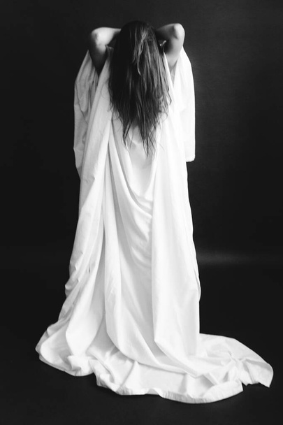 black and white studio portrait of a beautiful girl in a white sheet, beautiful female body, fashion and art - Fotoğraf, Görsel
