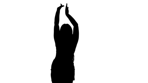 black silhouette on a white background, young beautiful woman dancing belly dance, oriental dance. Medium long shot - Imágenes, Vídeo