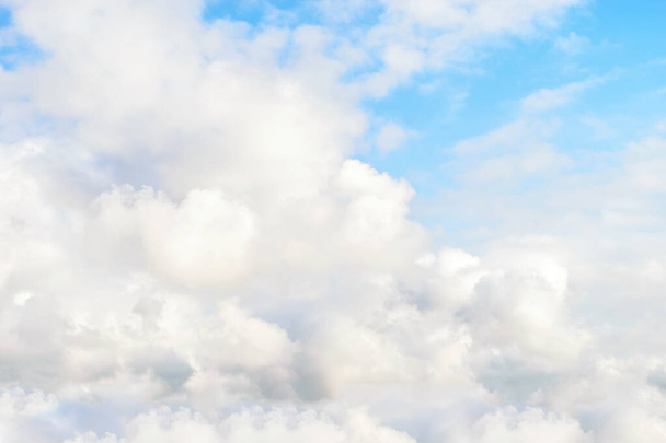 Blue textured sky with cumulus fluffy white clouds. Nice cloudy sky background.  - Photo, Image