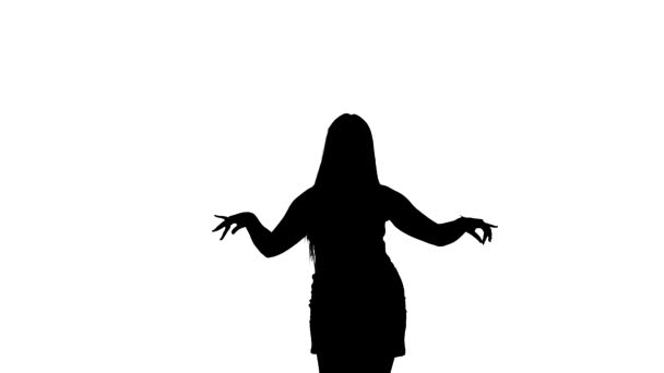 Medium long shot of a young beautiful dancer dancing belly dance, oriental dance, exotic dance, black silhouette on a white background - Felvétel, videó