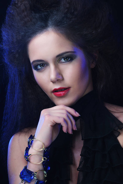 Young brunette woman with high hair and bright make up, gothic - Foto, Imagem