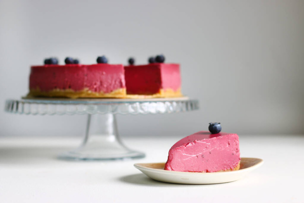 Blueberry cheesecake with fresh blueberries, selective focus. - Zdjęcie, obraz