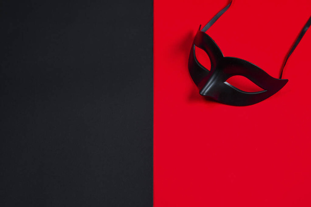 Sexy black mask on black and red background - Photo, Image