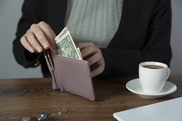 woman hand money with wallet on desk - Zdjęcie, obraz