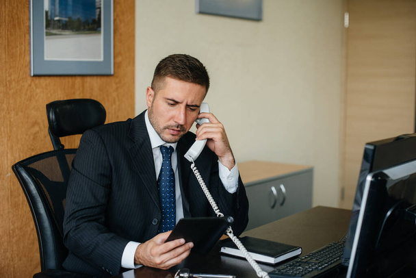 The Manager is on the phone in his office. Business, Finance - Foto, Imagem