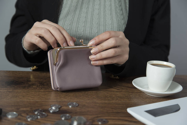  woman  hand purple wallet on table - Foto, Imagem