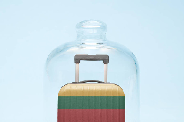 Suitcase with Lithuanian flag design in quarantine minimal creative coronavirus travel restriction concept. - Foto, imagen