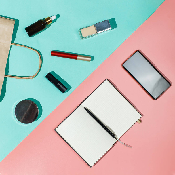 Delivery package with goods on a pink turquose background. Concept parcel, cargo, a variety of products, online store, contactlesss delivery, skin care cosmetics and makeup. Flat lay, top view square - 写真・画像
