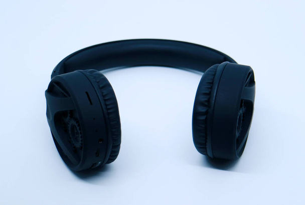 Black headphone on white background. - Photo, Image