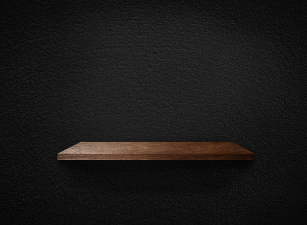 Light wood shelves on black wall texture in loft Style  background with clipping path. Design for wallpaper - Photo, Image