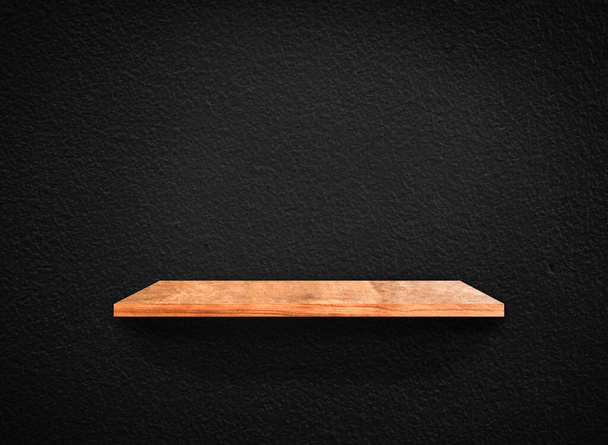 Light wood shelves on black wall texture in loft Style  background with clipping path. Design for wallpaper - Photo, Image