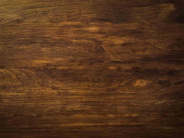 Donker hout textuur te gebruiken als natuurlijke achtergrond met kopieerruimte voor kunstwerken. Bovenaanzicht  - Foto, afbeelding