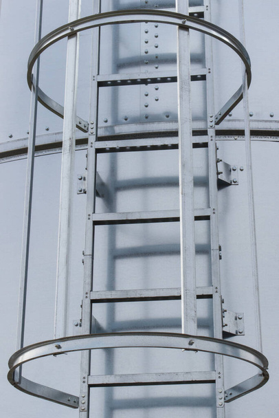 Ladder on silo for storage grain after harvest. Detail of agricultural equipments concept - Foto, immagini