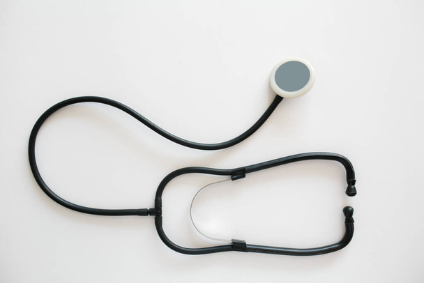 Black stethoscope isolated on white background. Healthcare - Foto, immagini