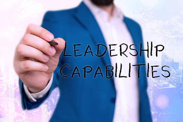 Handwriting text Leadership Capabilities. Concept meaning Set of Performance Expectations a Leader Competency. - Photo, Image