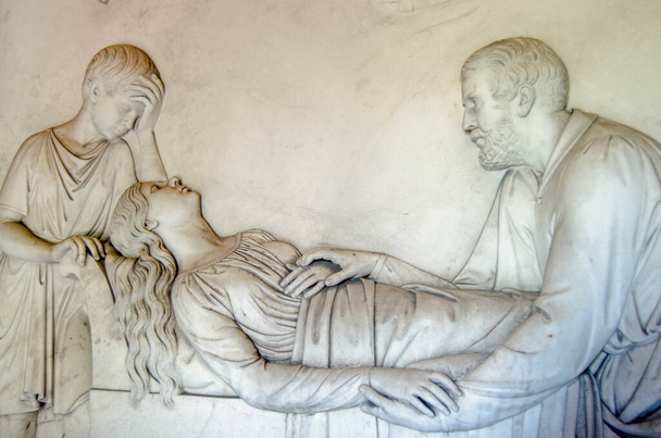 Marble frieze sculpted to show the 2nd Earl Kilmorey comforting his mistress Priscilla Anne Hoste as she lies on her deathbed in 1854 with their son David at her head.  Part of the historic Kilmorey Mausoleum, built in the 1850's and on public displa - Photo, Image