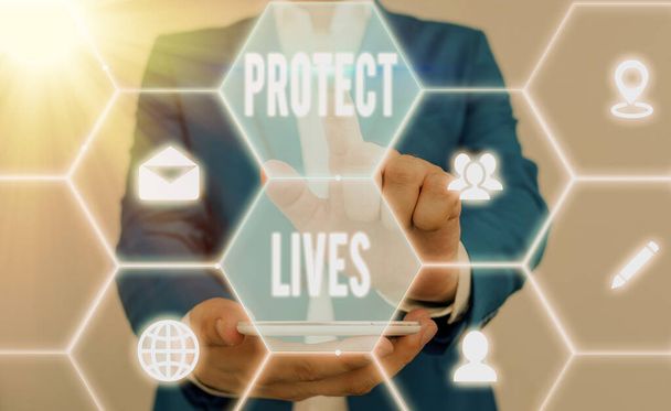 Szóírás szöveg Protect Lives. Üzleti koncepció a sugárterhelésnek való kitettség okozta sérülés vagy károsodás elleni védelemre vagy védelemre. - Fotó, kép