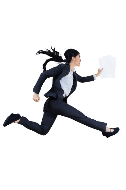 Businesswoman runs by holding business paper - Foto, imagen