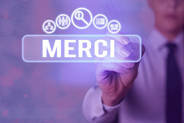 Writing note showing Merci. Business photo showcasing what is said or response when someone helps you in France Thank you. - Фото, зображення