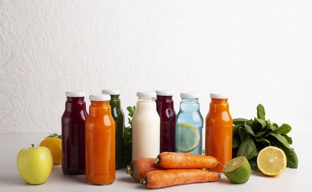 Detox set with different flavoured smoothie drinks in glass bottles - Foto, immagini