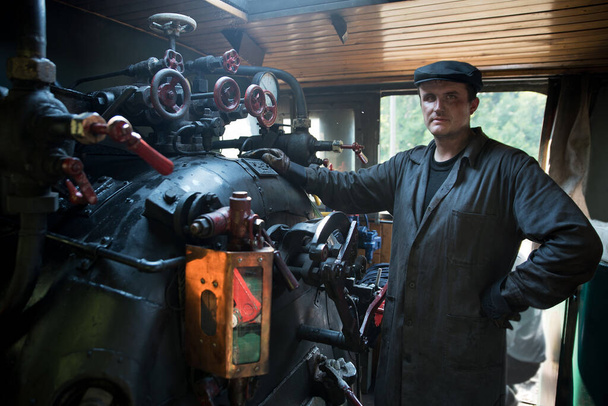 Portrait machinist assistant of a steam locomotive - Photo, Image