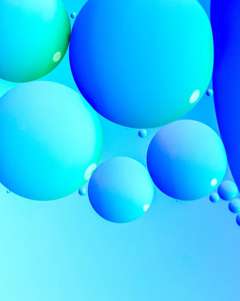 An amazing illustration of light blue bubbles on blue background - Foto, Imagem