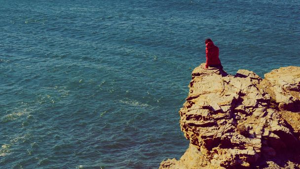 Tourist woman on spanish rocky coastline in Murcia region. Mediterranean Sea coast landscape, Calblanque Regional Park. - Φωτογραφία, εικόνα