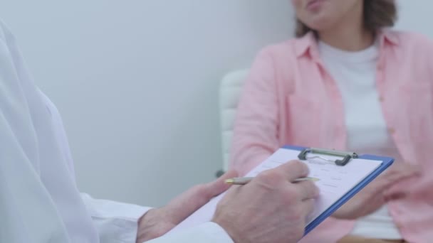 Doctor shaking patient's hand, recovering from illness, solution of problems - Felvétel, videó