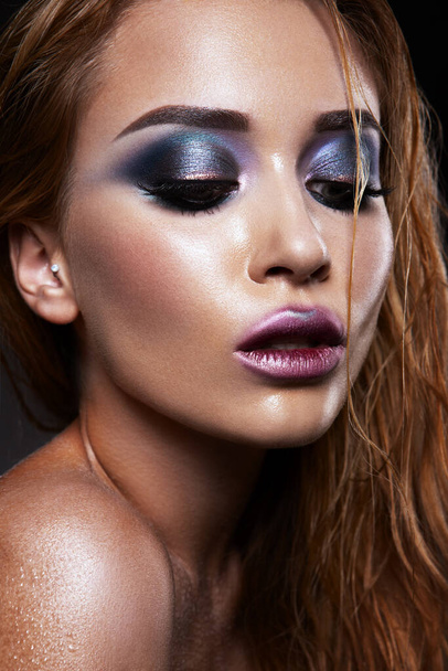 Beautiful young model with bright make-up. Blue eyeshadow - Foto, imagen